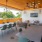 an outdoor lounge with tables and chairs