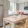 a kitchen with a table and chairs