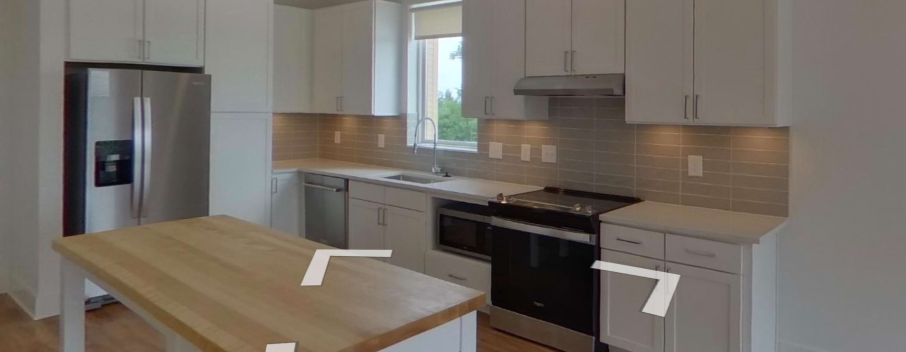 Well-lit kitchen with ample counter space