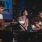 a group of people playing instruments on a stage
